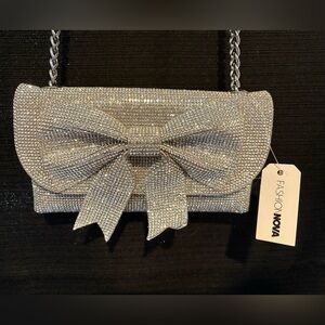 Fashion Nova Glittering Silver Bow Wristlet
